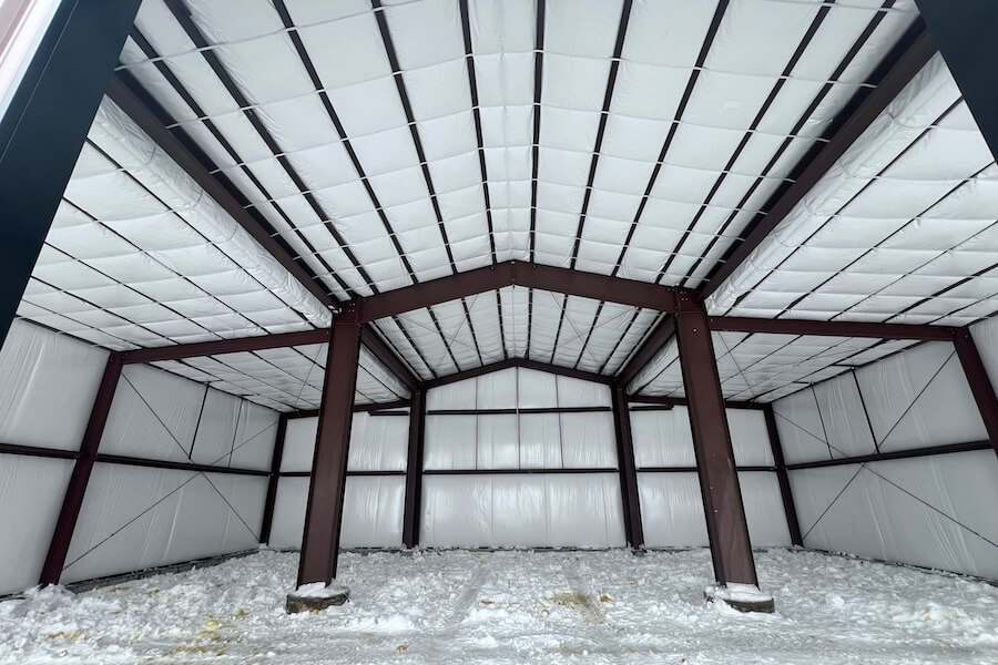 interior large building retail space, poured concrete floors, wood and steel roof interior beams