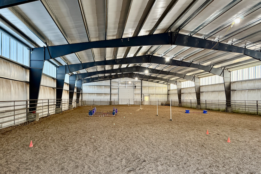 interior large building retail space, poured concrete floors, wood and steel roof interior beams