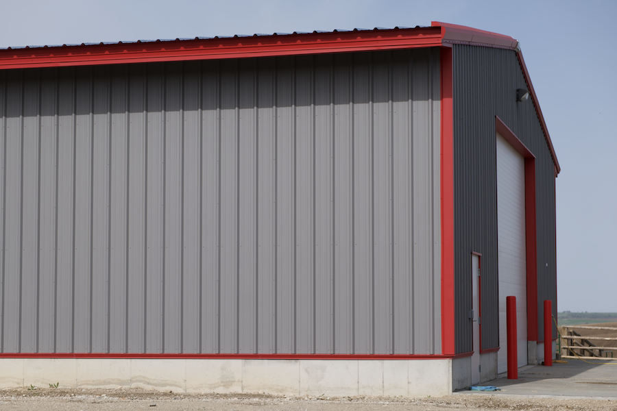 interior large building retail space, poured concrete floors, wood and steel roof interior beams