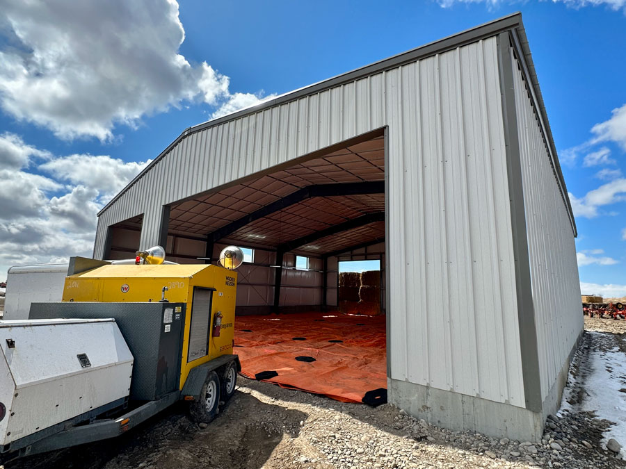 looking into mostly completed outbuilding structure from large door opening