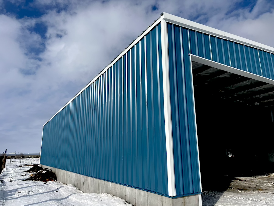 interior large building retail space, poured concrete floors, wood and steel roof interior beams