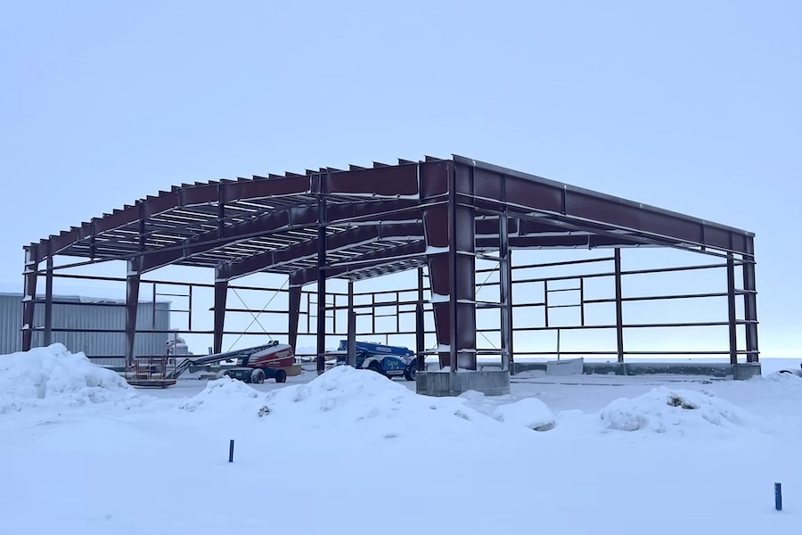 interior large building retail space, poured concrete floors, wood and steel roof interior beams