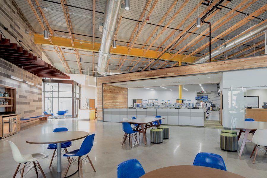 interior large building retail space, poured concrete floors, wood and steel roof interior beams