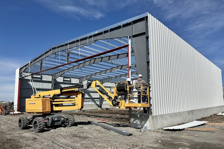 interior large building retail space, poured concrete floors, wood and steel roof interior beams